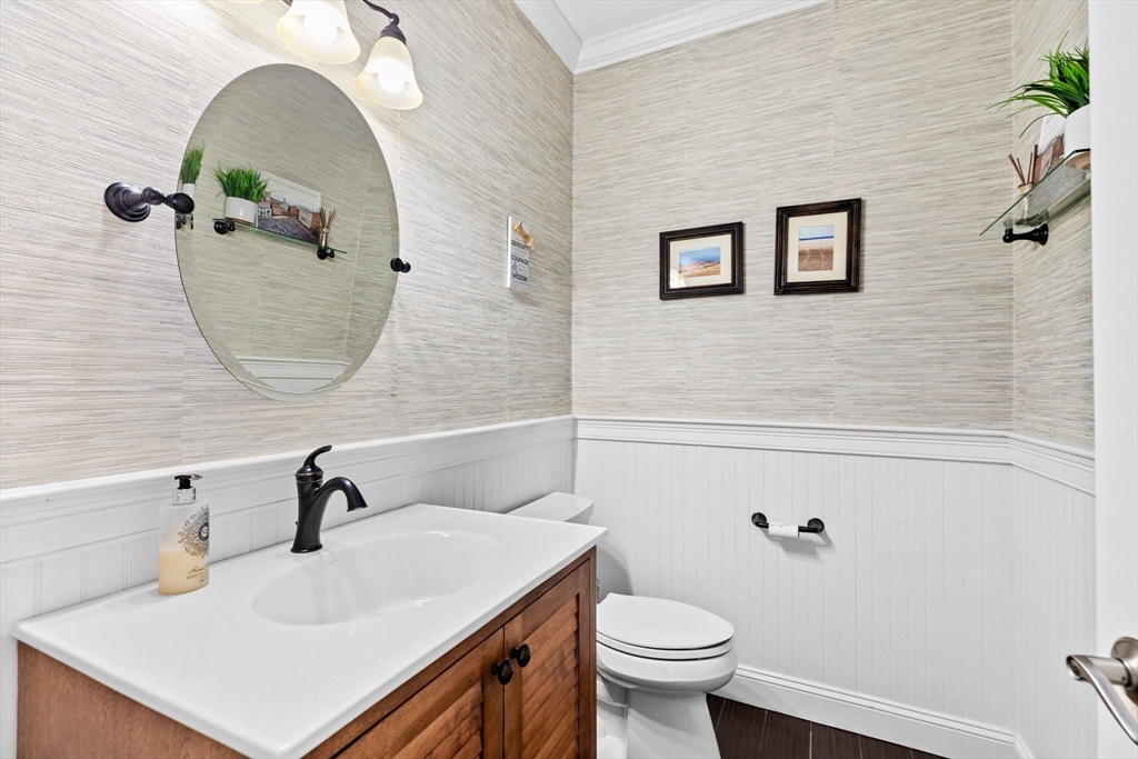 4 Baker Hill Drive Hingham, MA 02043 - Photo 20 of 40 a bathroom with a sink mirror and toilet
