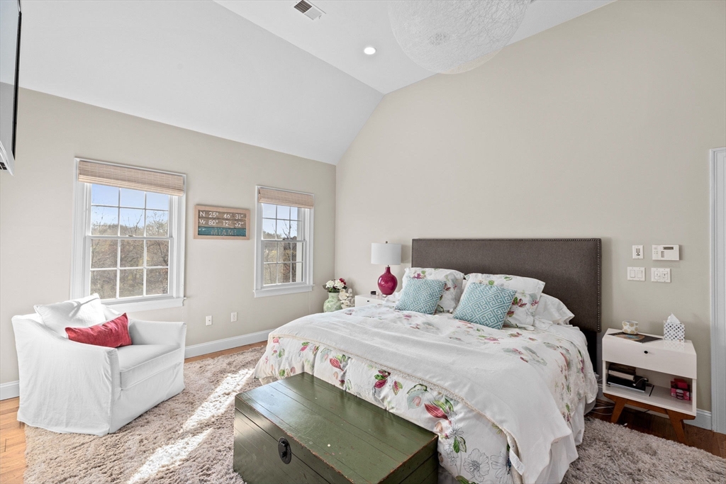 4 Baker Hill Drive Hingham, MA 02043 - Photo 21 of 40 a bedroom with a bed and wooden floor