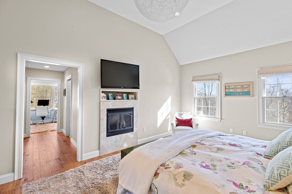 4 Baker Hill Drive Hingham, MA 02043 - Photo 22 of 40 a bedroom with a bed and a flat screen tv