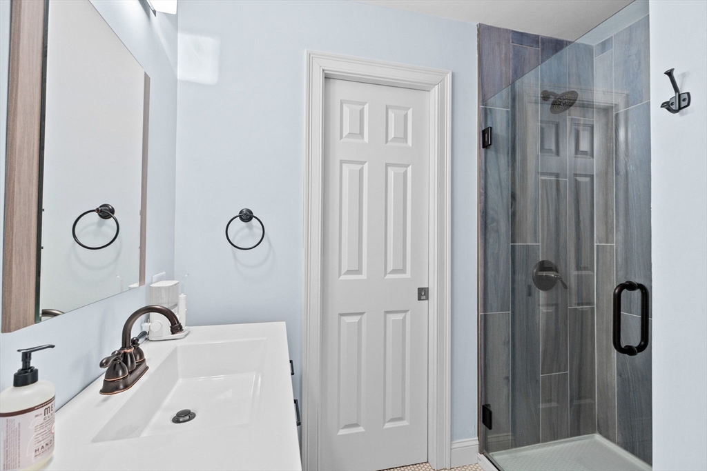 4 Baker Hill Drive Hingham, MA 02043 - Photo 31 of 40 a bathroom with a shower and sink