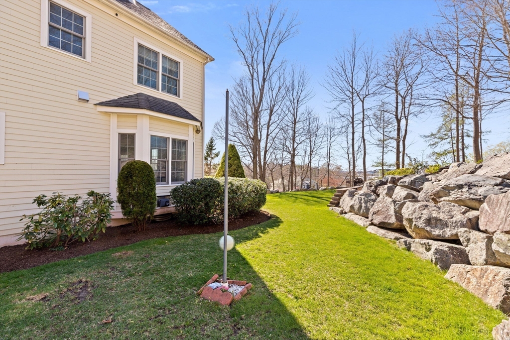 4 Baker Hill Drive Hingham, MA 02043 - Photo 37 of 40 a front view of a house with garden