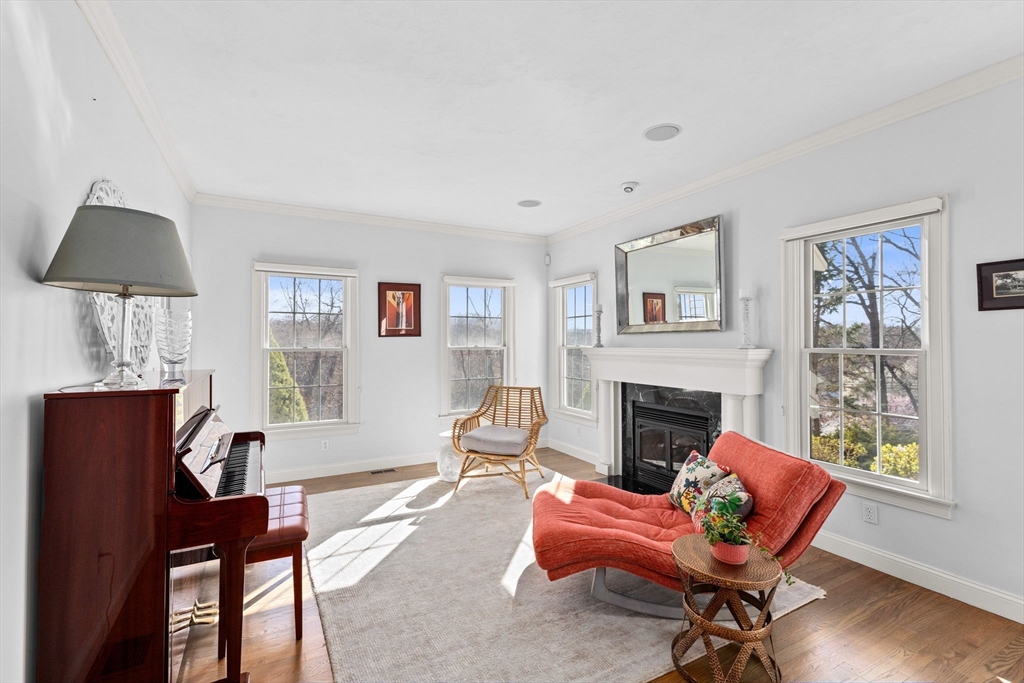 4 Baker Hill Drive Hingham, MA 02043 - Photo 6 of 40 a living room with furniture a fireplace and a window