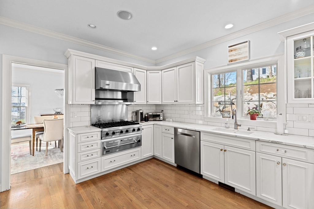 4 Baker Hill Drive Hingham, MA 02043 - Photo 9 of 40 a kitchen with white cabinets and appliances