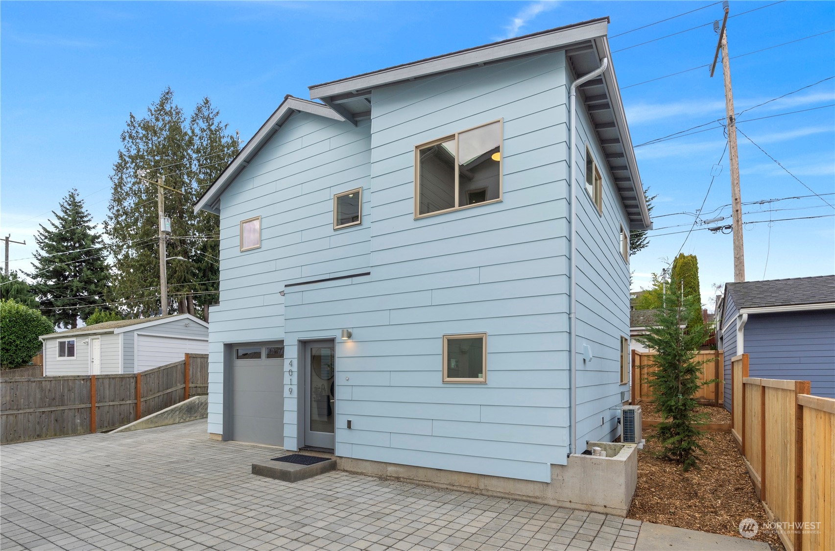 4019 51st Avenue Southwest Seattle, WA 98116 - Photo 1 of 33 a view of a house and a yard