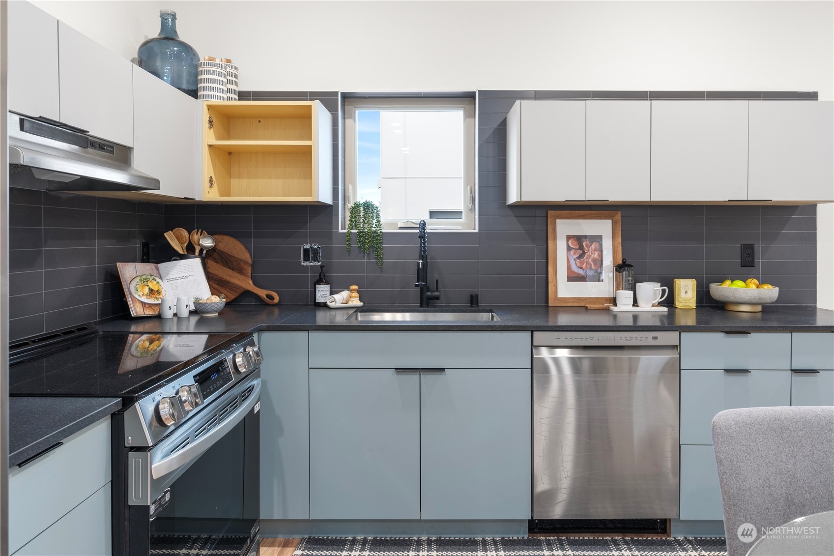 4019 51st Avenue Southwest Seattle, WA 98116 - Photo 11 of 33 a kitchen with a sink and cabinets