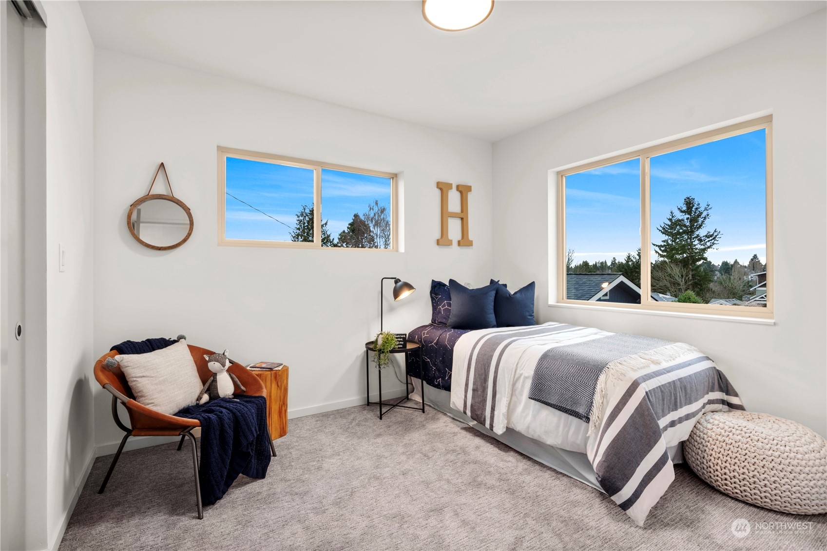 4019 51st Avenue Southwest Seattle, WA 98116 - Photo 20 of 33 a bed room with a bed and a chair