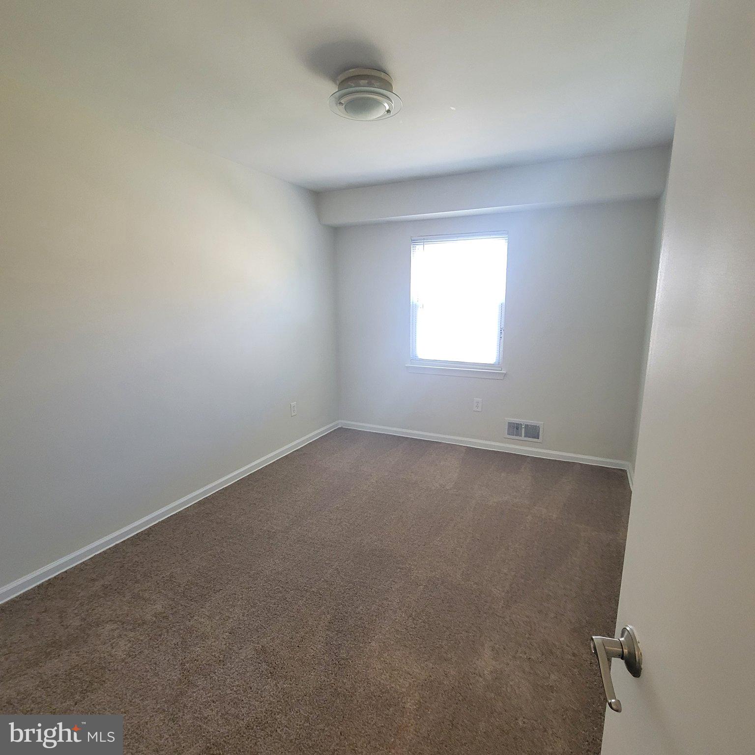 1833 Addison Road South District Heights, MD 20747 - Photo 11 of 14 an empty room with a window