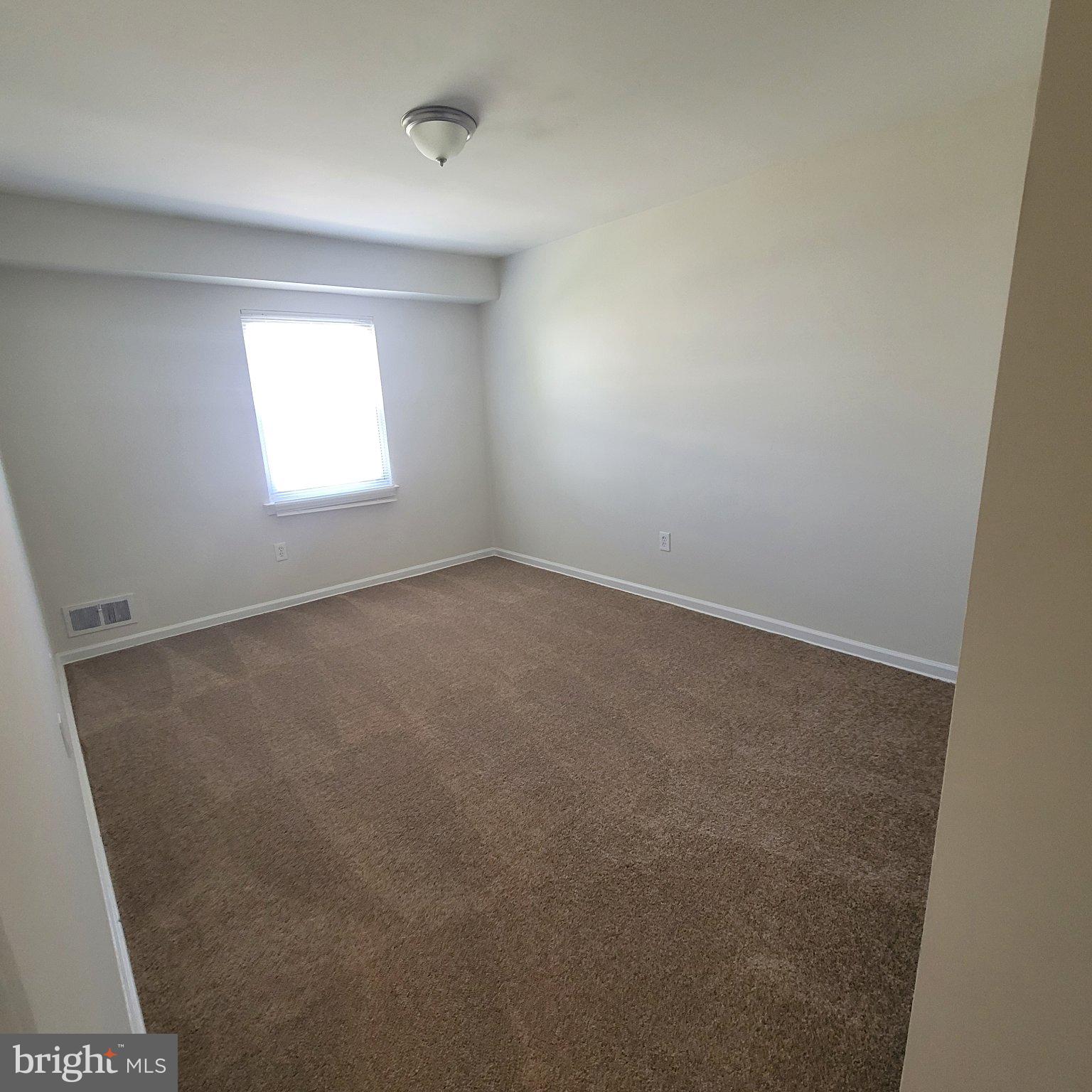 1833 Addison Road South District Heights, MD 20747 - Photo 12 of 14 an empty room with a window