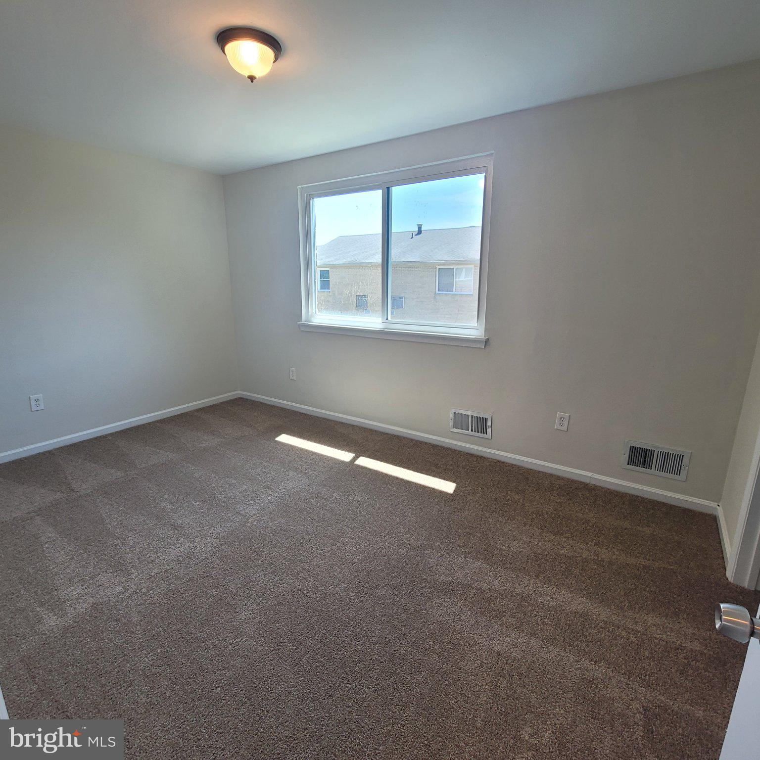 1833 Addison Road South District Heights, MD 20747 - Photo 14 of 14 an empty room with a window