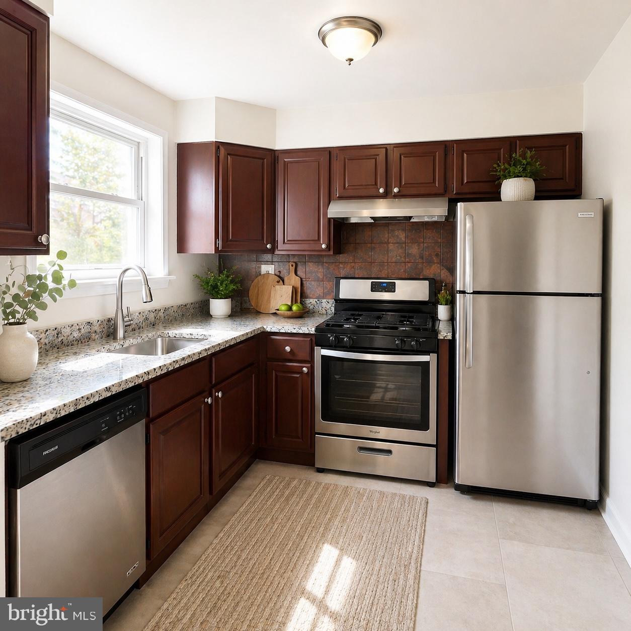 1833 Addison Road South District Heights, MD 20747 - Photo 2 of 14 a kitchen with a sink a stove and a refrigerator