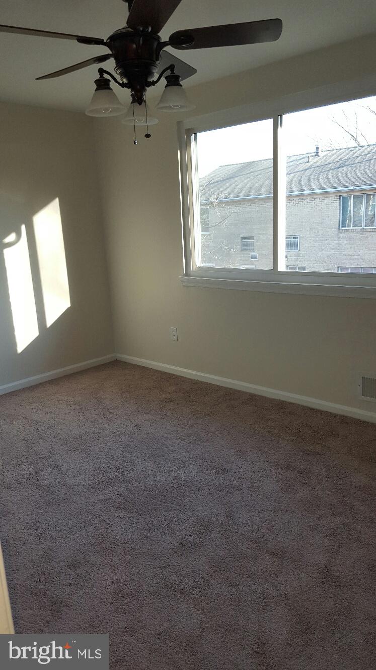 1833 Addison Road South District Heights, MD 20747 - Photo 4 of 10 a view of an empty room and a window