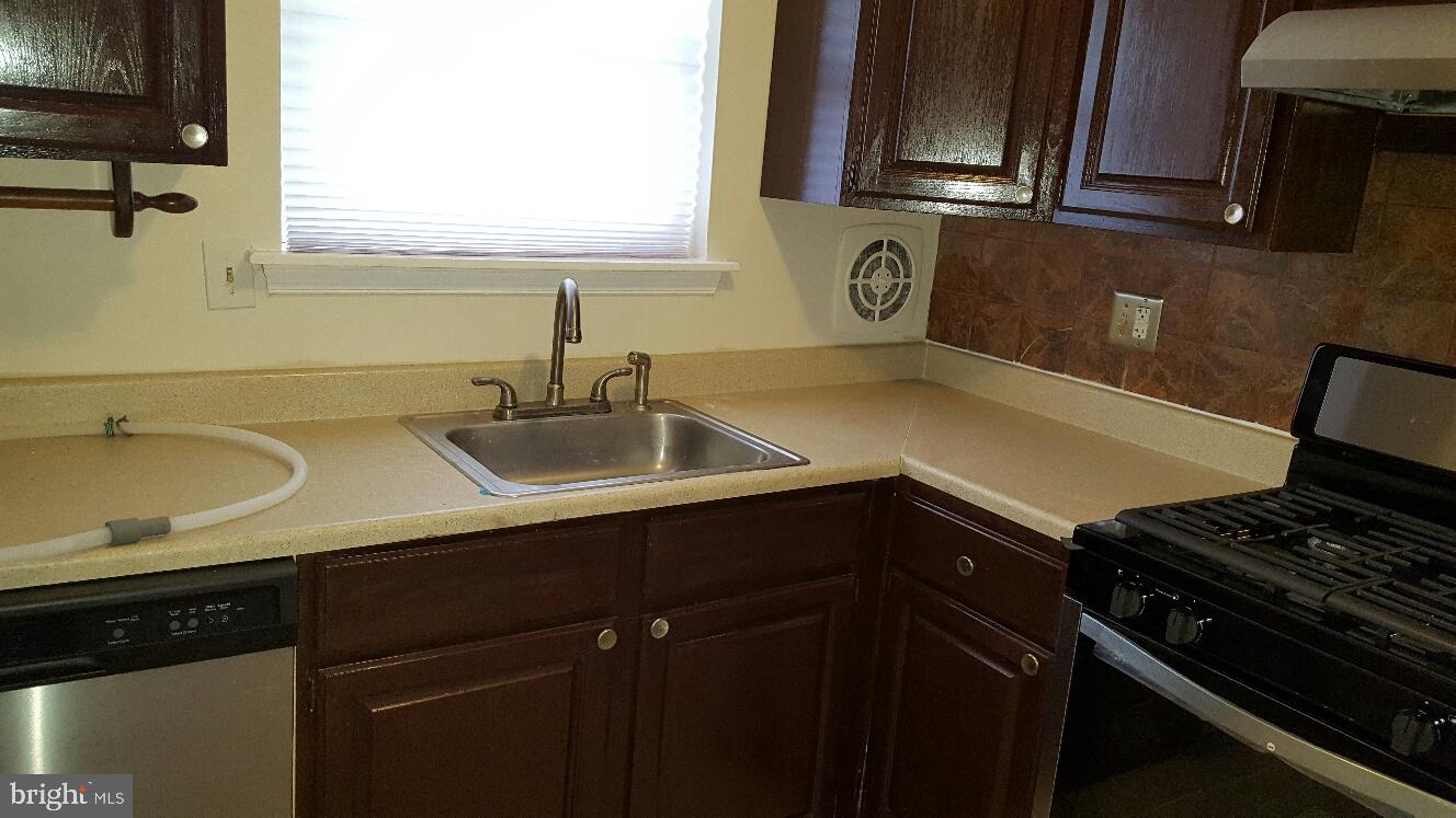 1833 Addison Road South District Heights, MD 20747 - Photo 10 of 10 a kitchen with a sink and cabinets