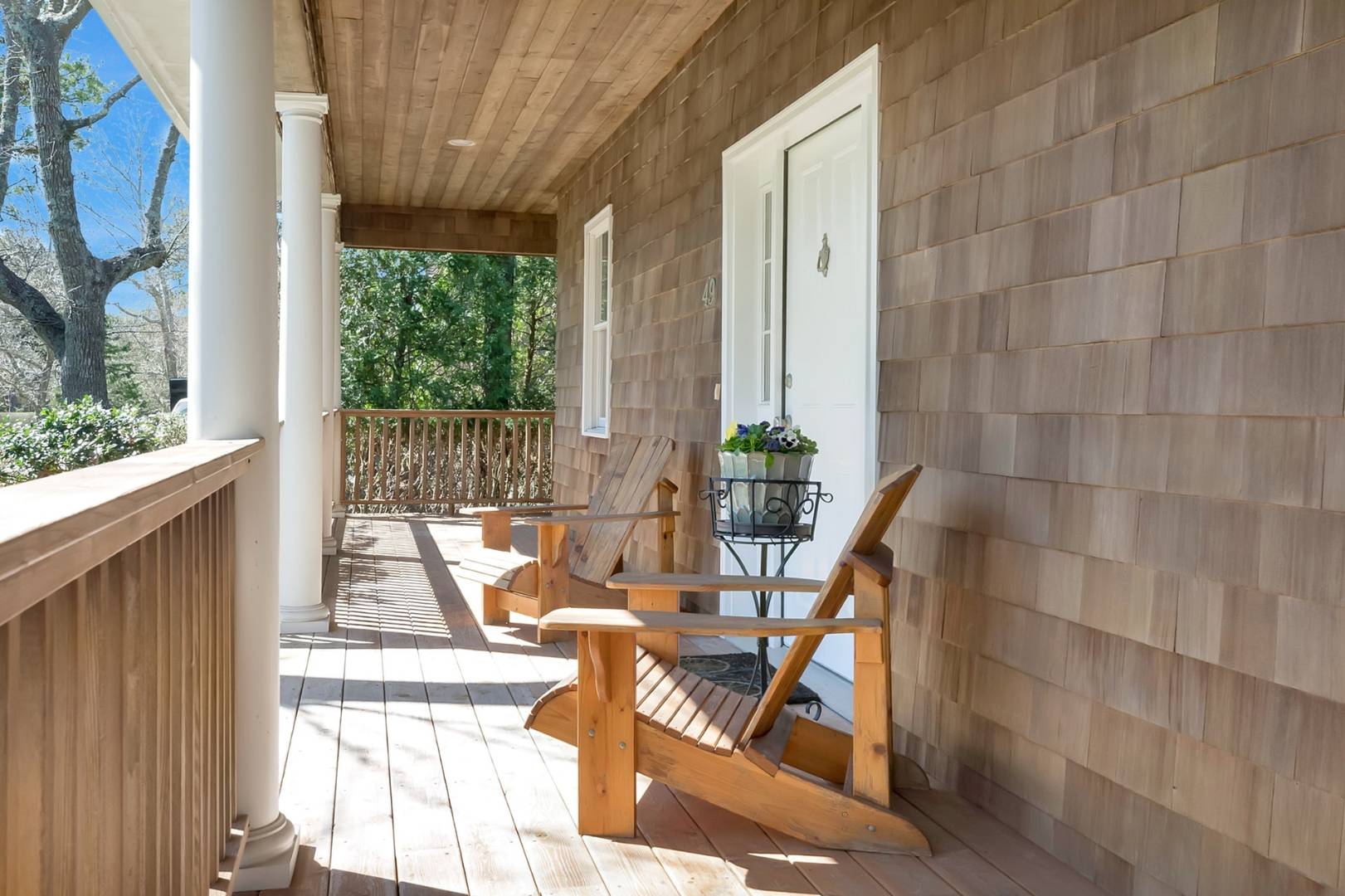 49 Bridle Path Westhampton Beach, NY 11978 - Photo 2 of 37 a view of balcony with two chairs and a table