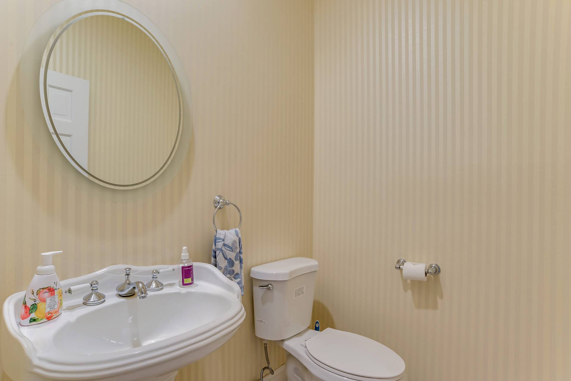 49 Bridle Path Westhampton Beach, NY 11978 - Photo 12 of 37 a white toilet sitting next to a bathroom sink