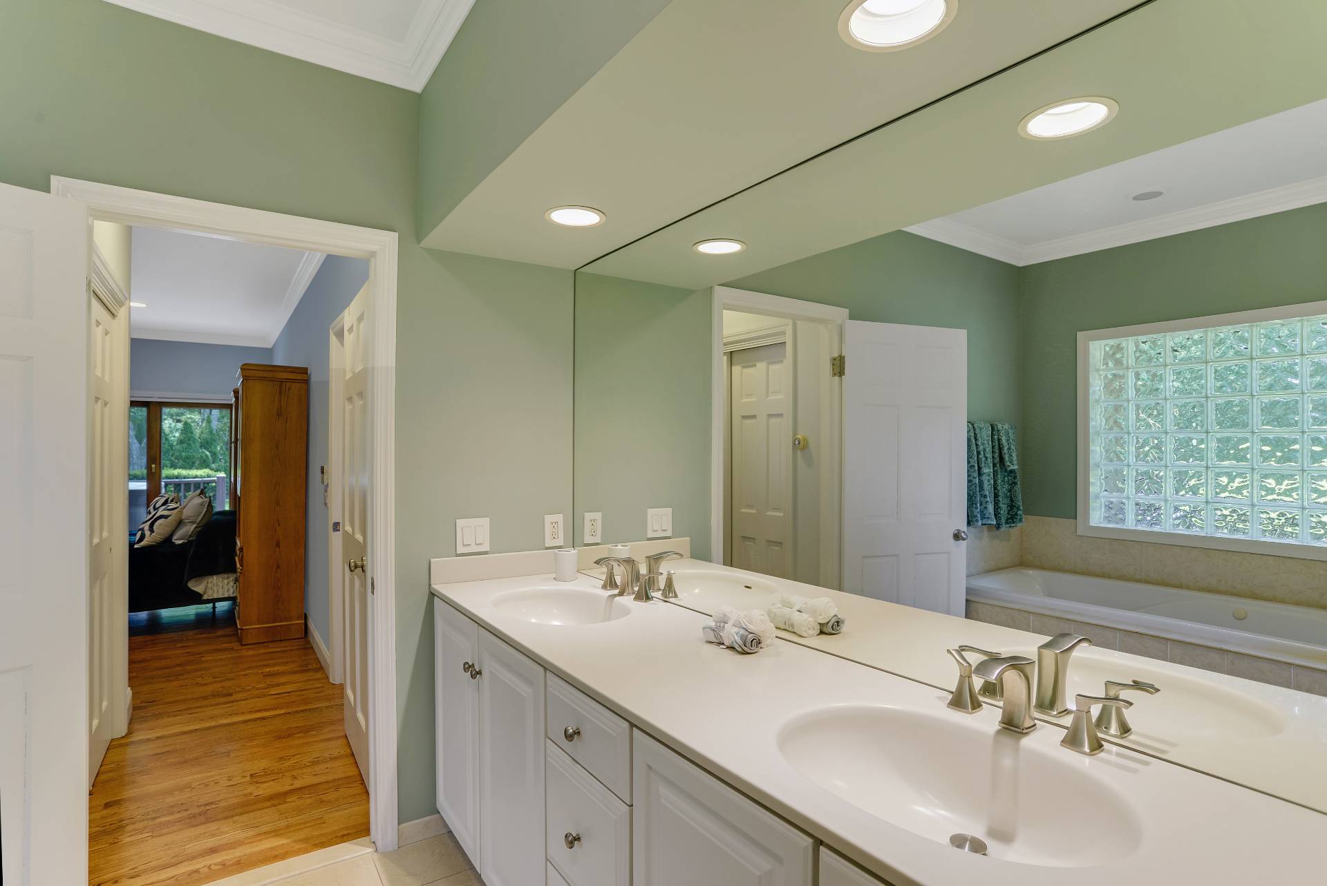 49 Bridle Path Westhampton Beach, NY 11978 - Photo 15 of 37 a bathroom with a double vanity sink and a mirror