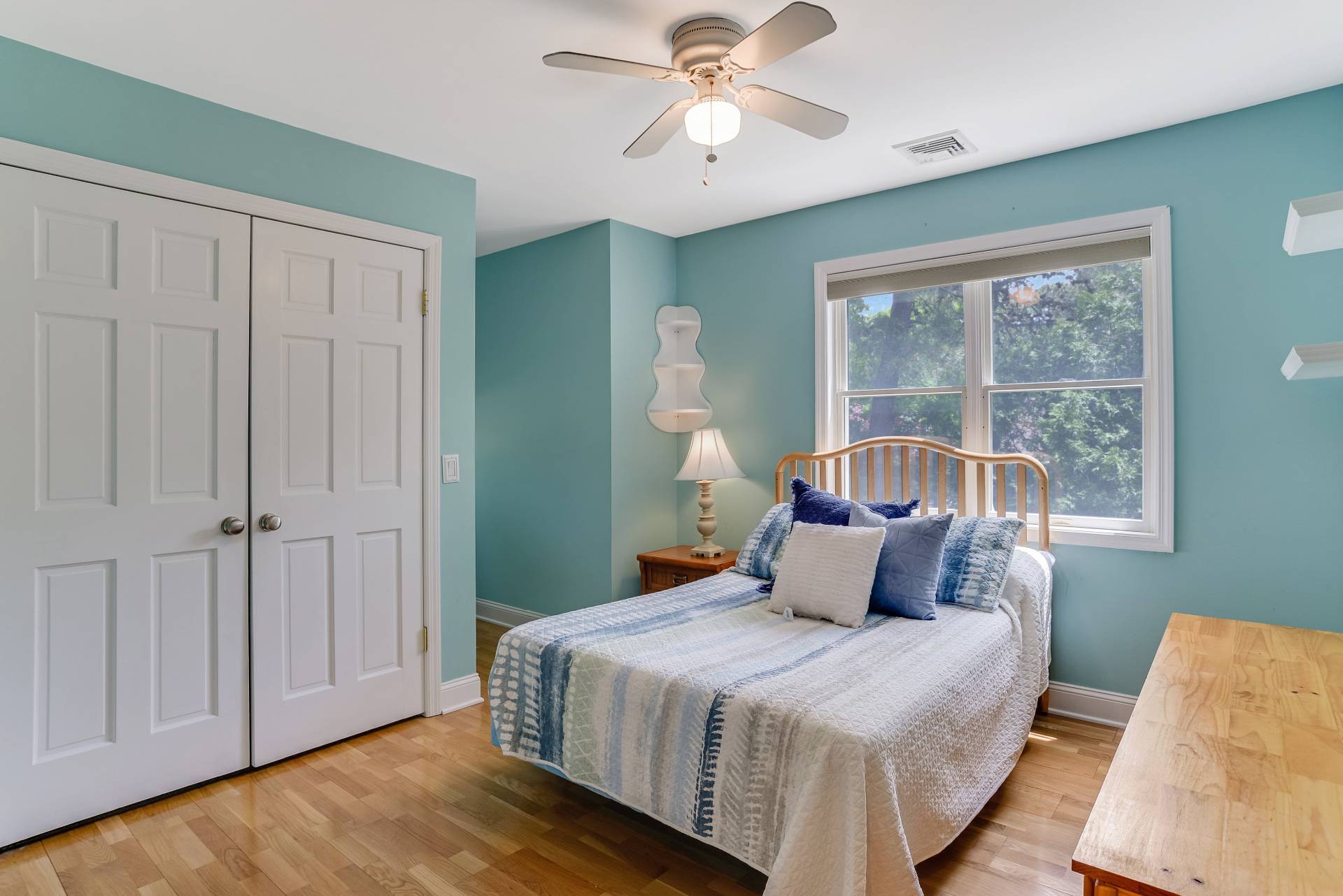 49 Bridle Path Westhampton Beach, NY 11978 - Photo 18 of 37 a bedroom with a large bed and a chandelier