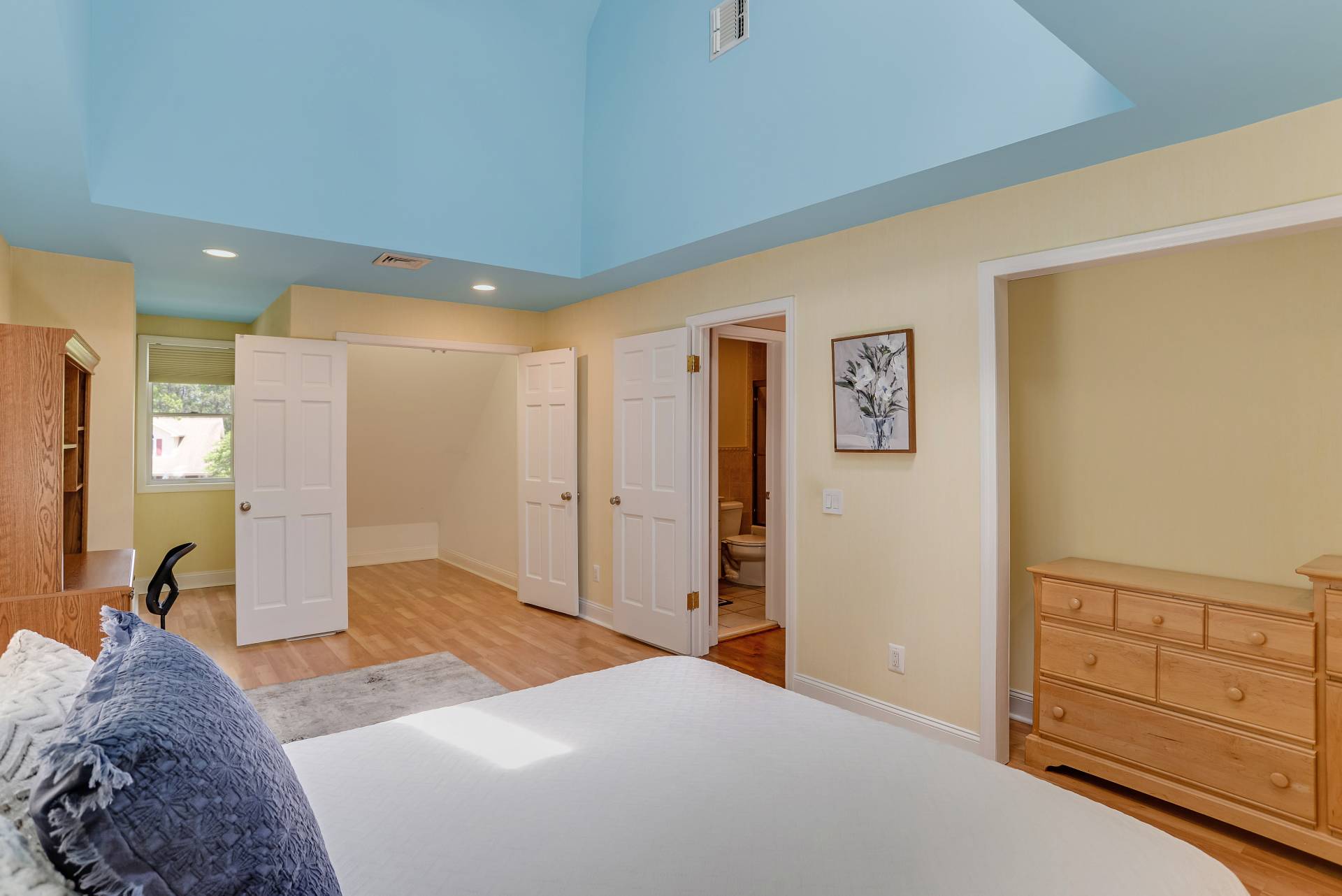 49 Bridle Path Westhampton Beach, NY 11978 - Photo 22 of 37 a spacious bedroom with a bed and a dresser