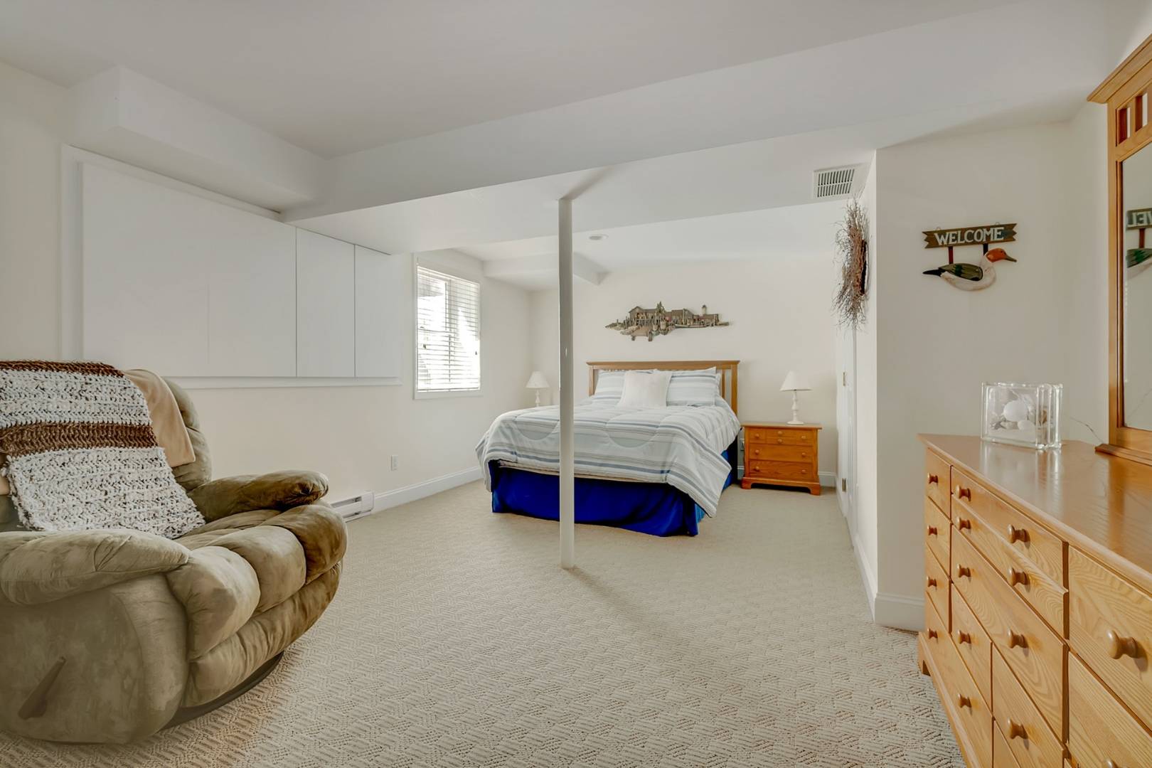 49 Bridle Path Westhampton Beach, NY 11978 - Photo 29 of 37 a bedroom with bed and window