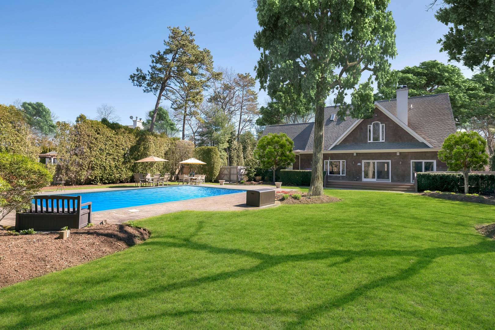 49 Bridle Path Westhampton Beach, NY 11978 - Photo 30 of 37 a front view of house with yard and green space