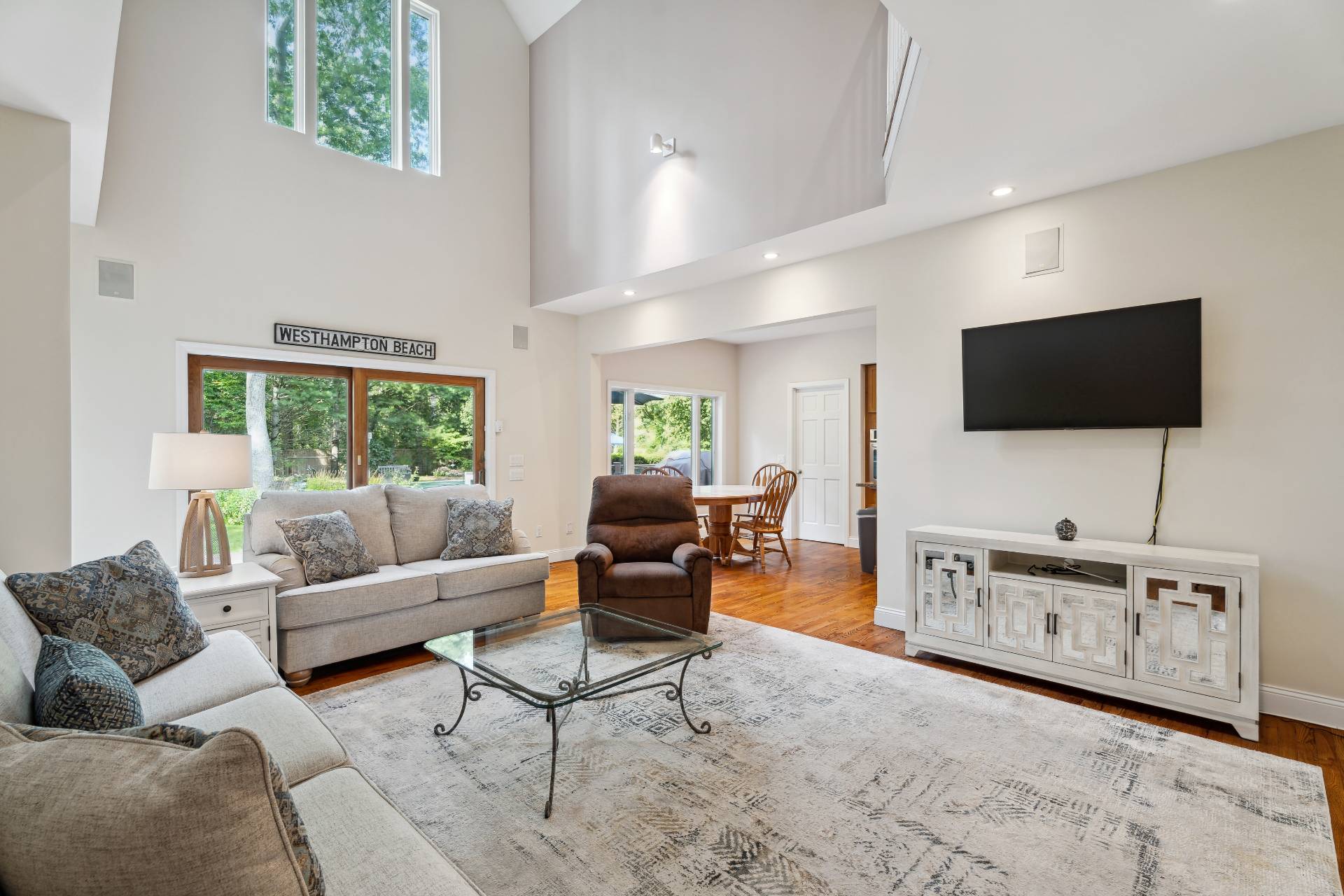 49 Bridle Path Westhampton Beach, NY 11978 - Photo 4 of 37 a living room with furniture and a flat screen tv