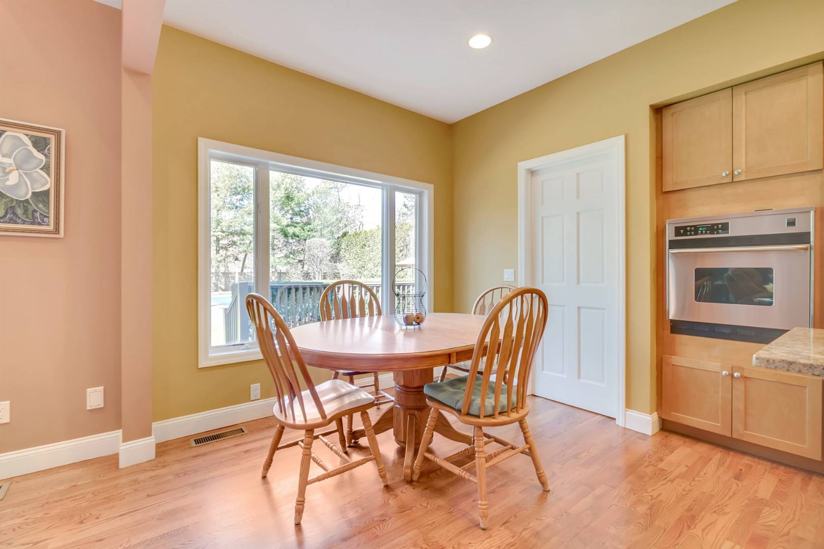 49 Bridle Path Westhampton Beach, NY 11978 - Photo 7 of 37 a kitchen with sink a stove and cabinets