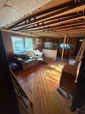 a view of living room with furniture and floor to ceiling window