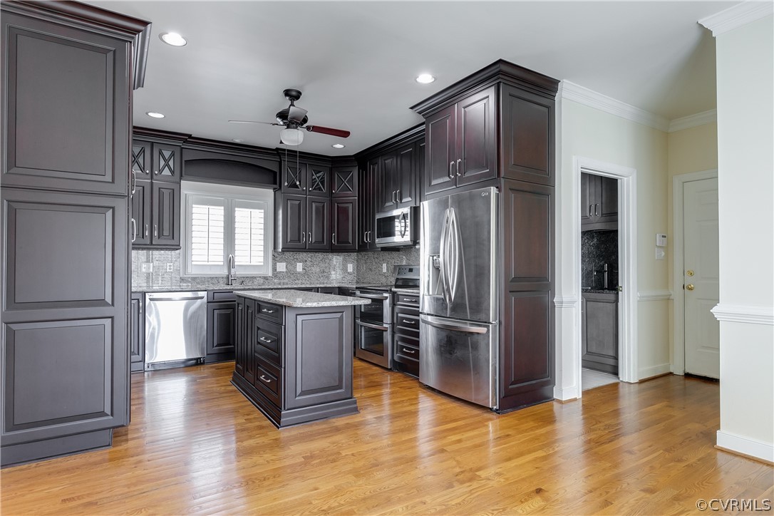 1931 Thornleigh Road Midlothian, VA 23113 - Photo 11 of 46 a kitchen with granite countertop stainless steel appliances a refrigerator cabinets and wooden floor