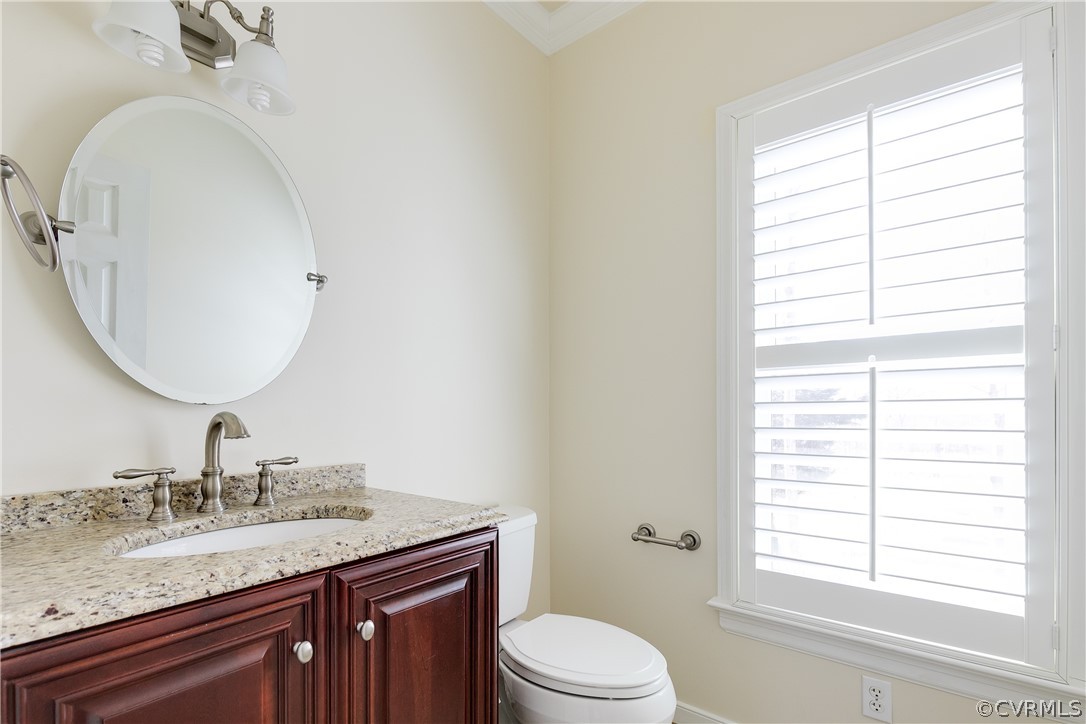 1931 Thornleigh Road Midlothian, VA 23113 - Photo 14 of 46 a bathroom with a granite countertop toilet a sink and a mirror