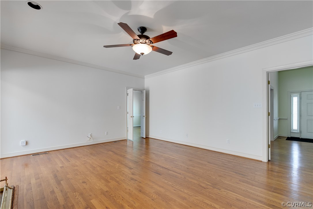 1931 Thornleigh Road Midlothian, VA 23113 - Photo 21 of 46 an empty room with wooden floor fan and windows
