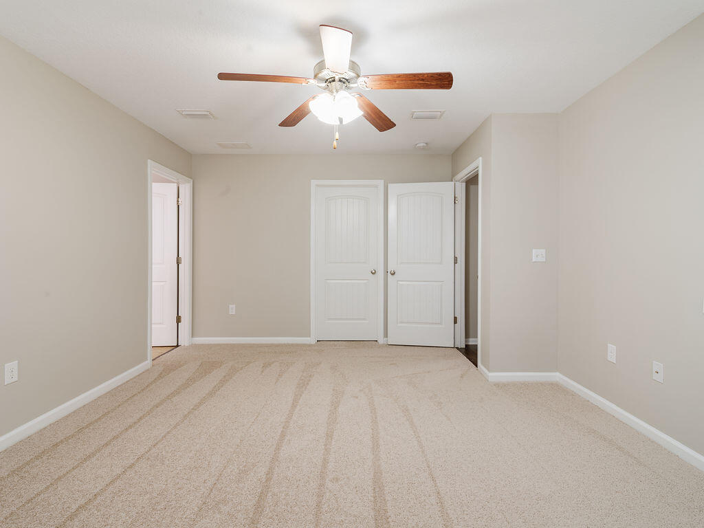 4889 Spears Street Pace, FL 32571 - Photo 13 of 25 a view of an empty room with a window