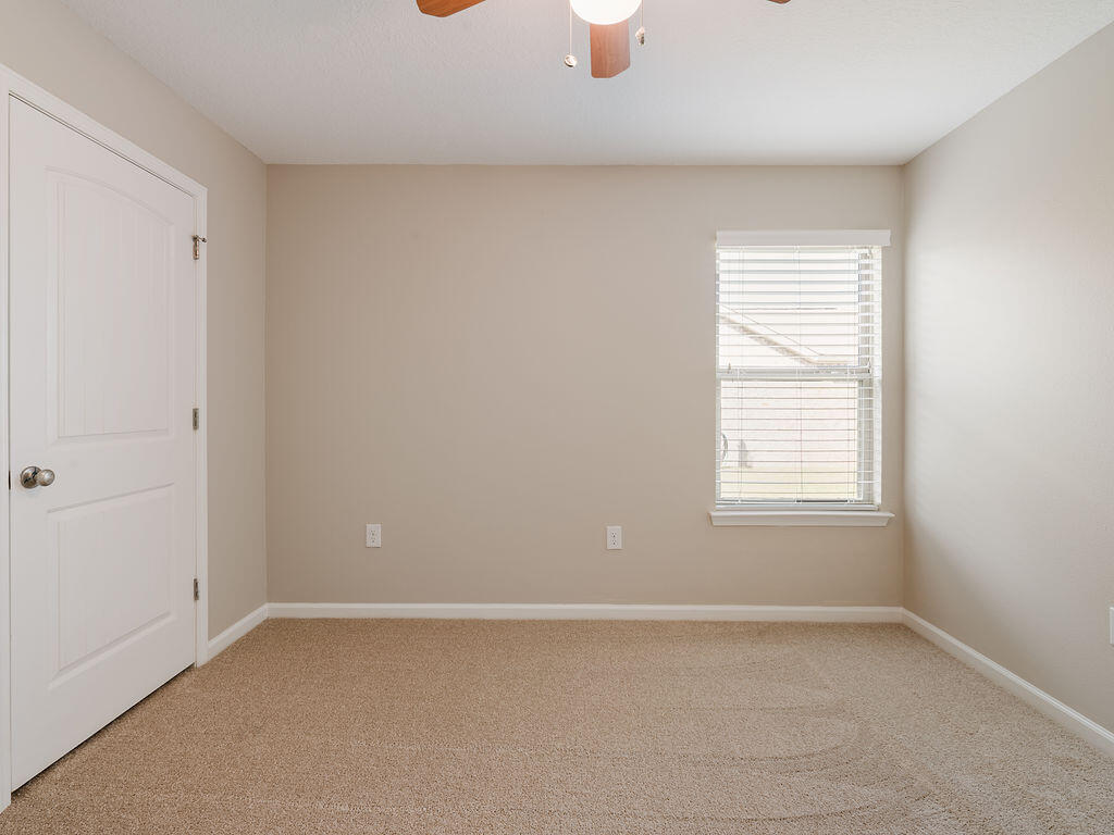 4889 Spears Street Pace, FL 32571 - Photo 18 of 25 an empty room with a window