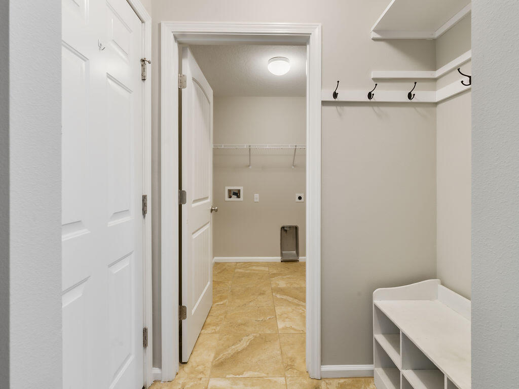 4889 Spears Street Pace, FL 32571 - Photo 19 of 25 a bathroom with a shower and a sink