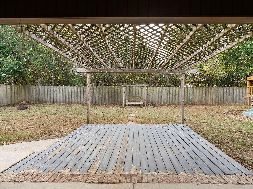 4889 Spears Street Pace, FL 32571 - Photo 22 of 25 a view of wooden deck