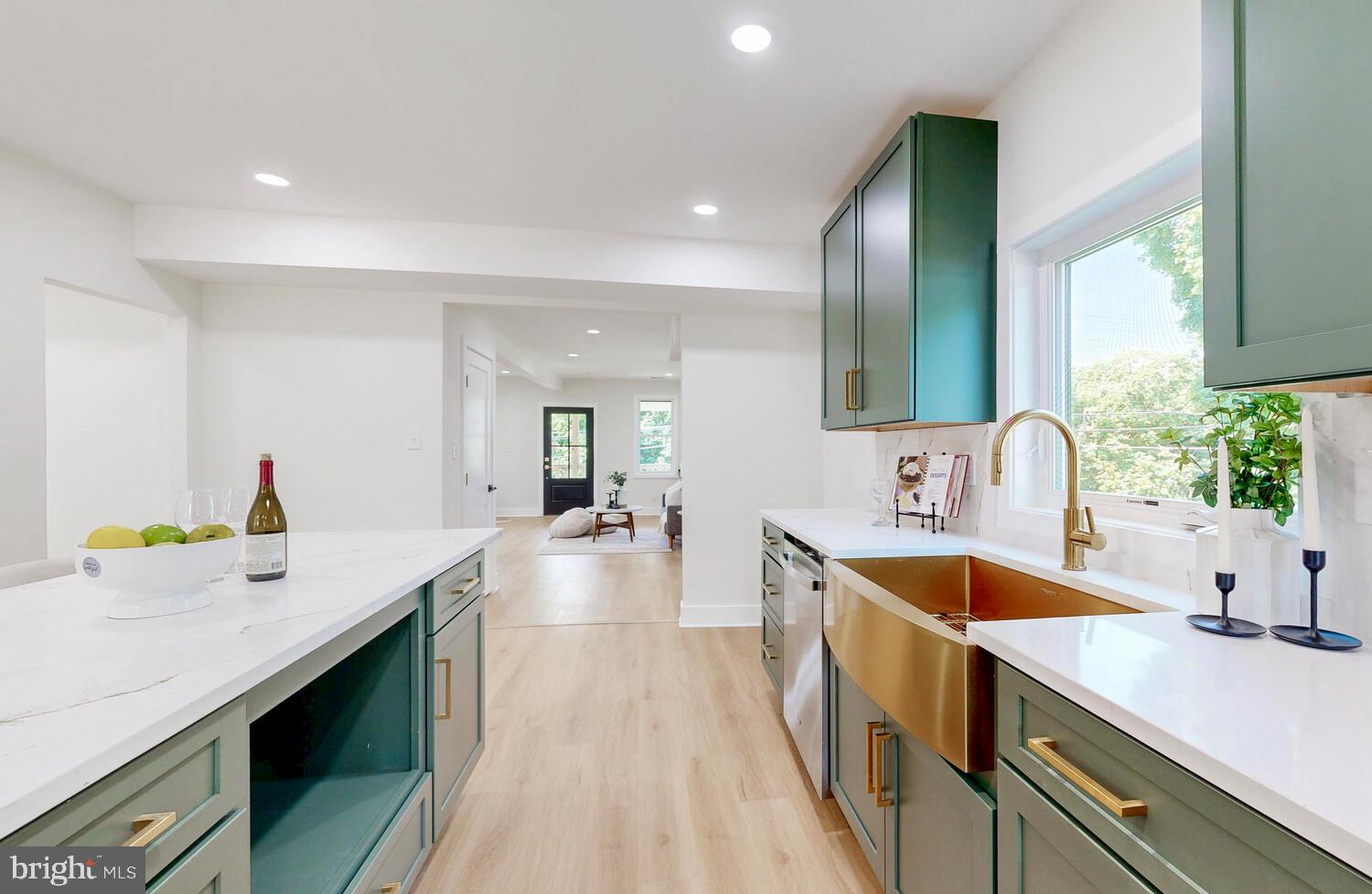 4414 Mt Carmel Road Hampstead, MD 21074 - Photo 12 of 40 a view of a kitchen with a sink and dishwasher a stove top oven with wooden floor