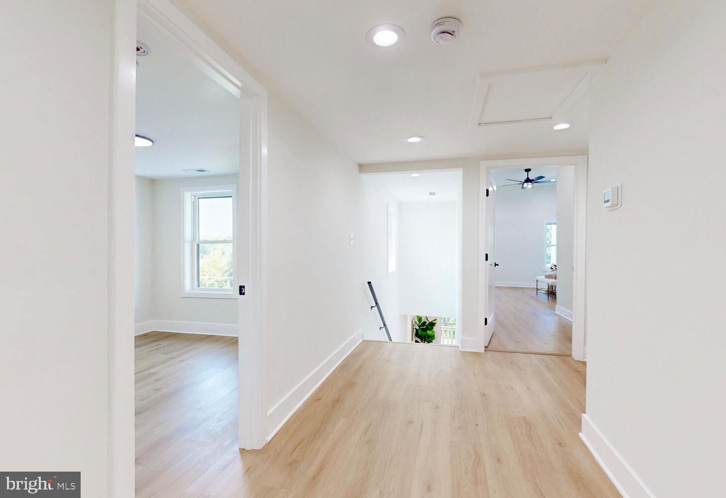 4414 Mt Carmel Road Hampstead, MD 21074 - Photo 16 of 40 a view of a hallway with wooden floor and a bathroom
