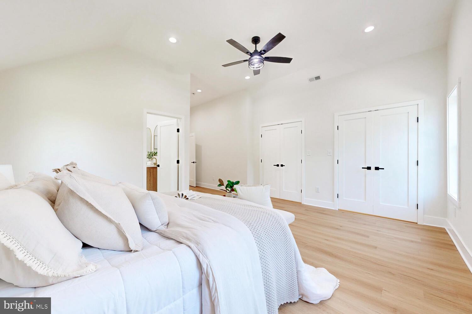 4414 Mt Carmel Road Hampstead, MD 21074 - Photo 19 of 40 a bedroom with a bed and a chandelier