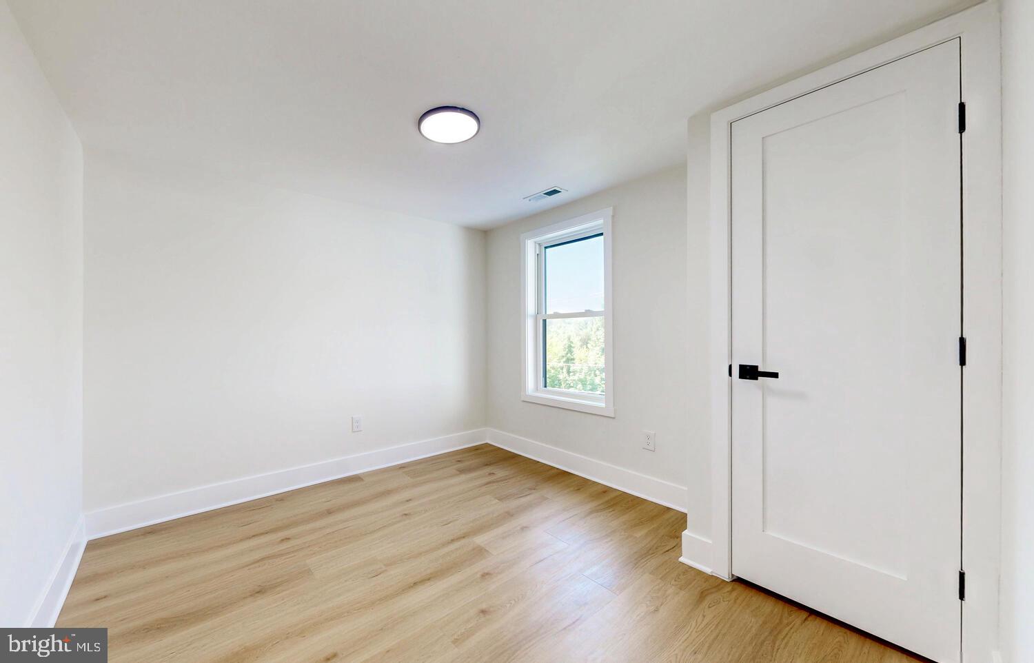 4414 Mt Carmel Road Hampstead, MD 21074 - Photo 25 of 40 an empty room and wooden floor