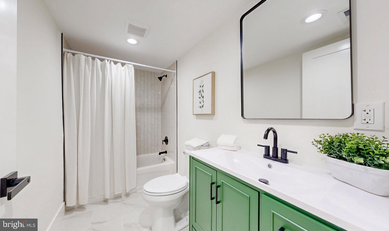 4414 Mt Carmel Road Hampstead, MD 21074 - Photo 26 of 40 a bathroom with a sink a toilet and shower