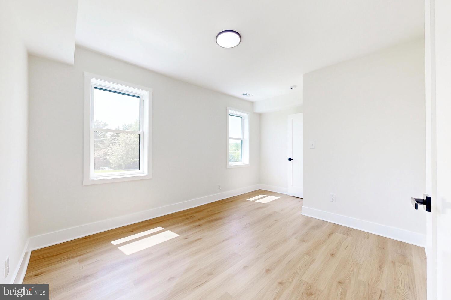 4414 Mt Carmel Road Hampstead, MD 21074 - Photo 27 of 40 a view of an empty room with wooden floor and a window