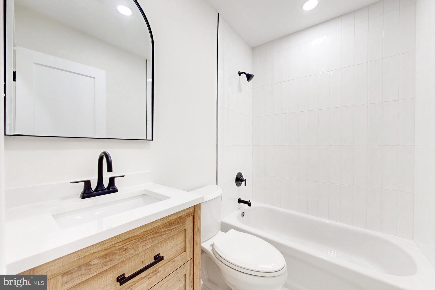 4414 Mt Carmel Road Hampstead, MD 21074 - Photo 29 of 40 a bathroom with a sink a toilet and shower