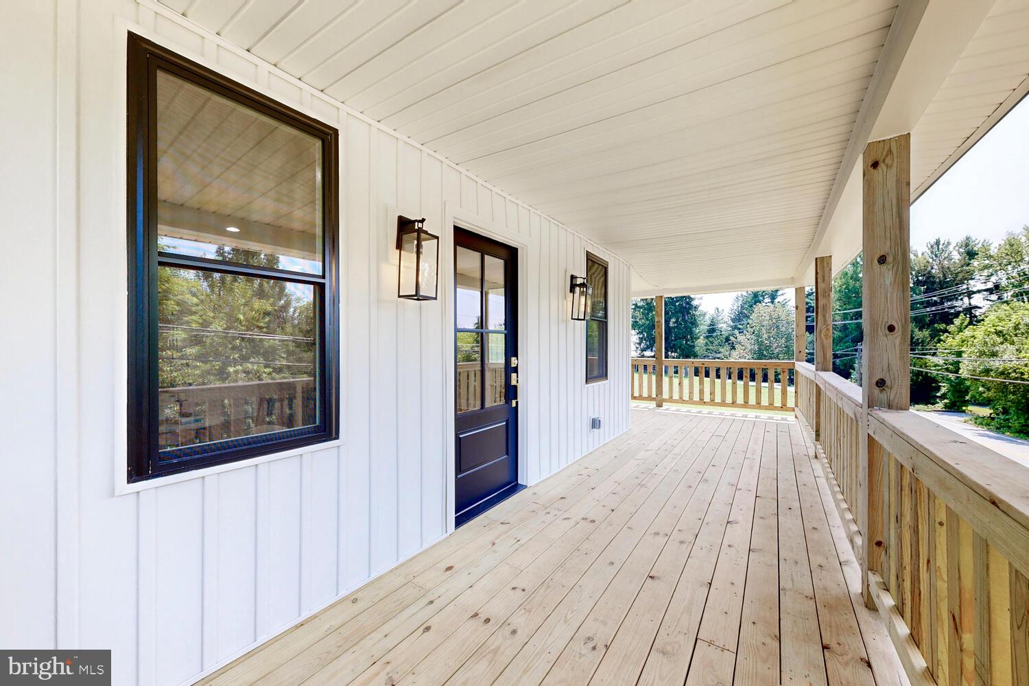 4414 Mt Carmel Road Hampstead, MD 21074 - Photo 3 of 40 a view of a bedroom with wooden floor and windows