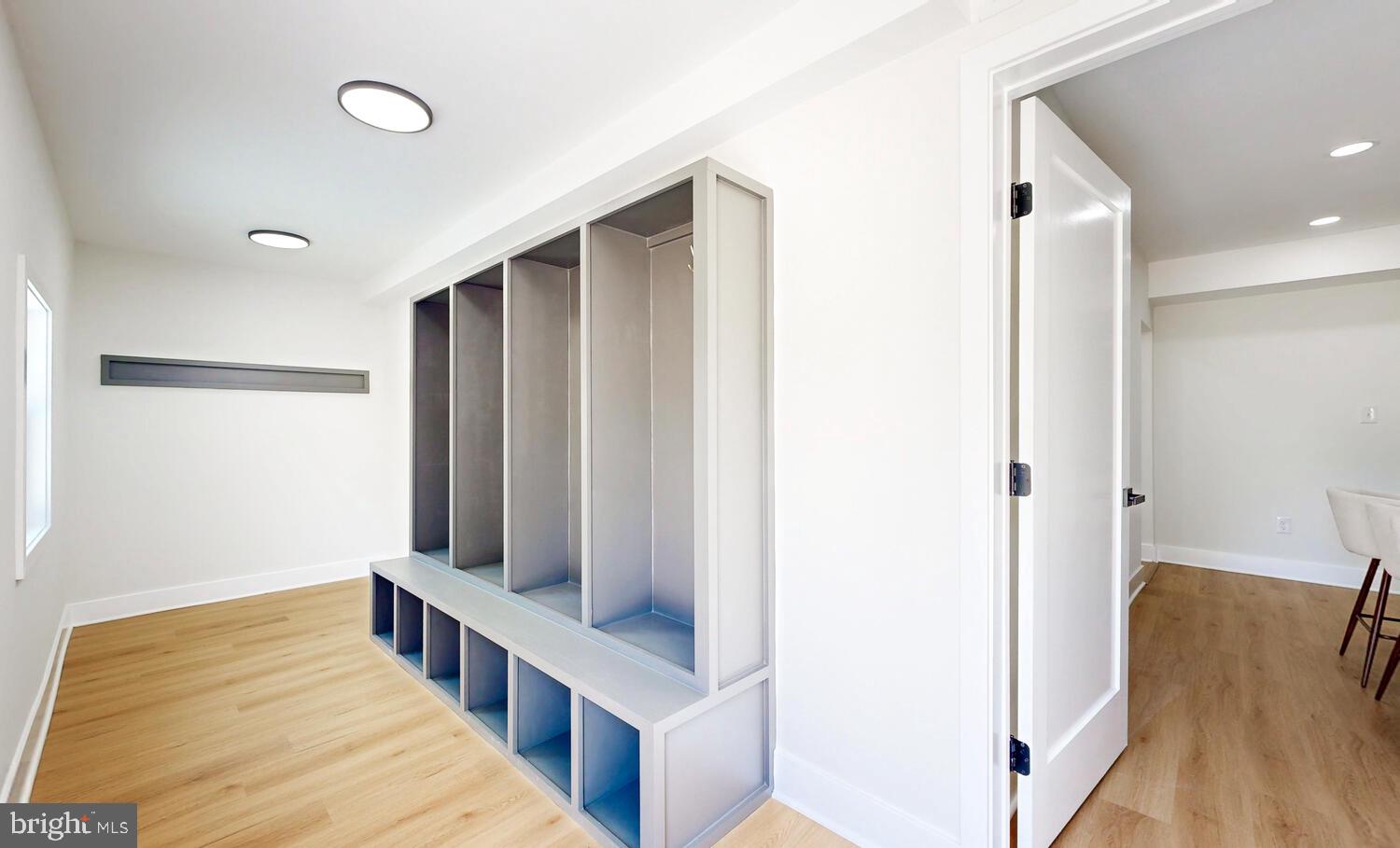 4414 Mt Carmel Road Hampstead, MD 21074 - Photo 31 of 40 a hallway with wooden floor and windows