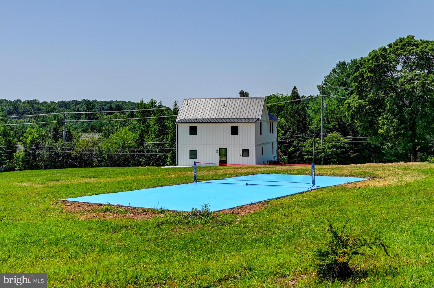 4414 Mt Carmel Road Hampstead, MD 21074 - Photo 36 of 40 a view of pool with lawn chairs and large trees