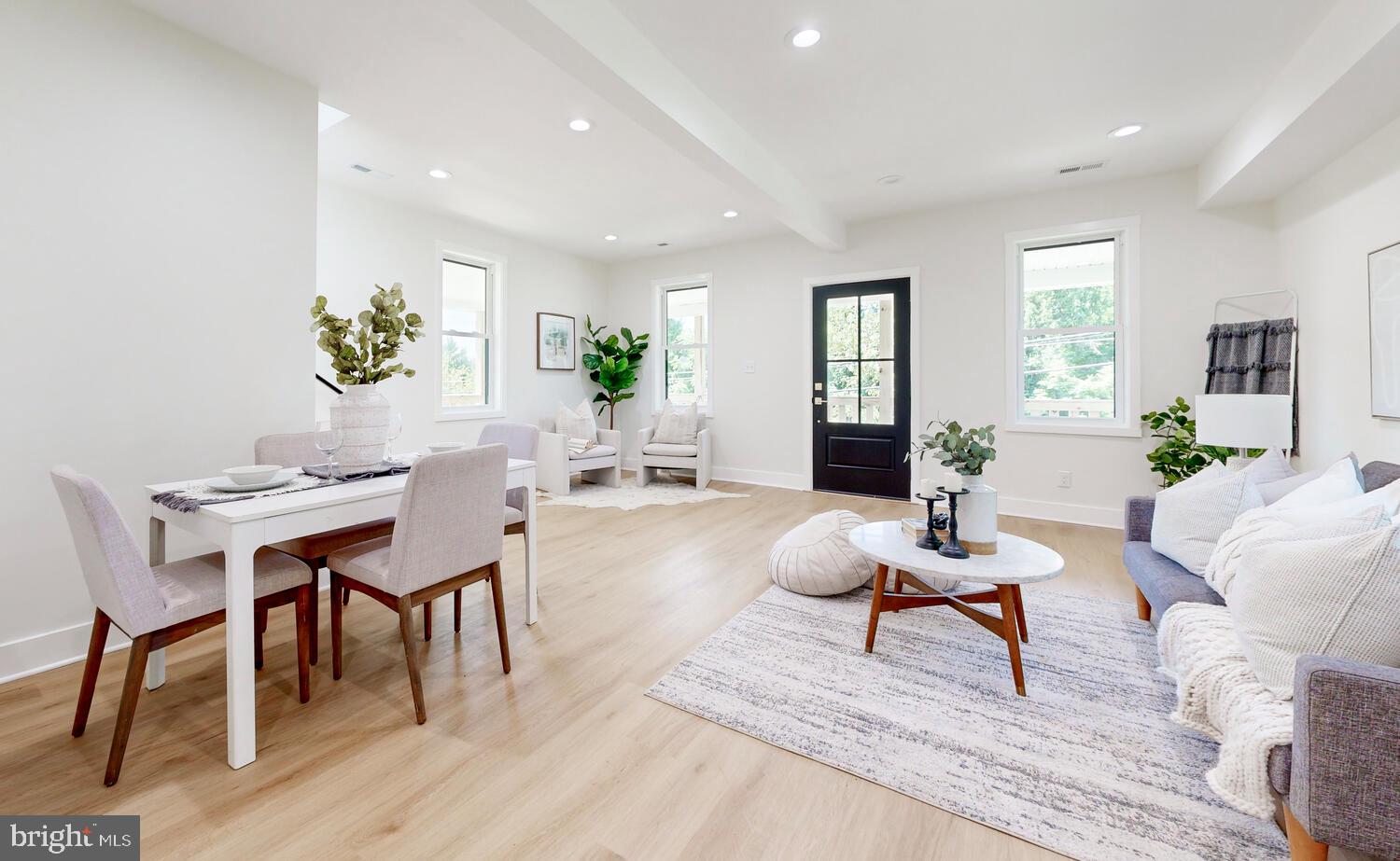 4414 Mt Carmel Road Hampstead, MD 21074 - Photo 7 of 40 a living room with furniture a potted plant and open kitchen view