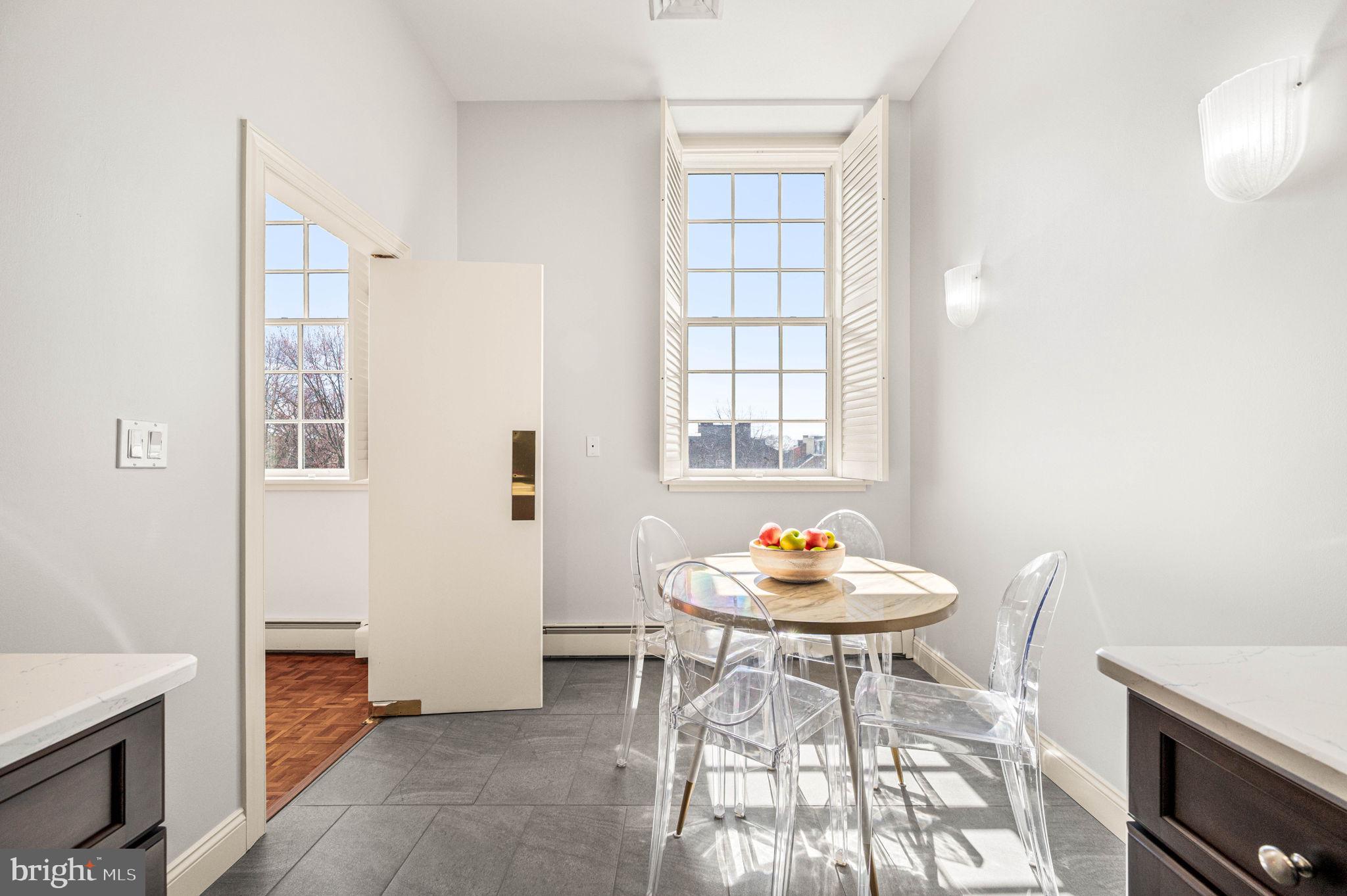 211 South 4th Street, Unit 301 Philadelphia, PA 19106 - Photo 13 of 42 a table and chairs in a room