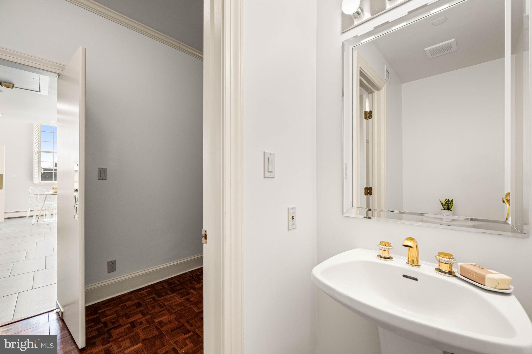 211 South 4th Street, Unit 301 Philadelphia, PA 19106 - Photo 20 of 42 a bathroom with a sink and a mirror