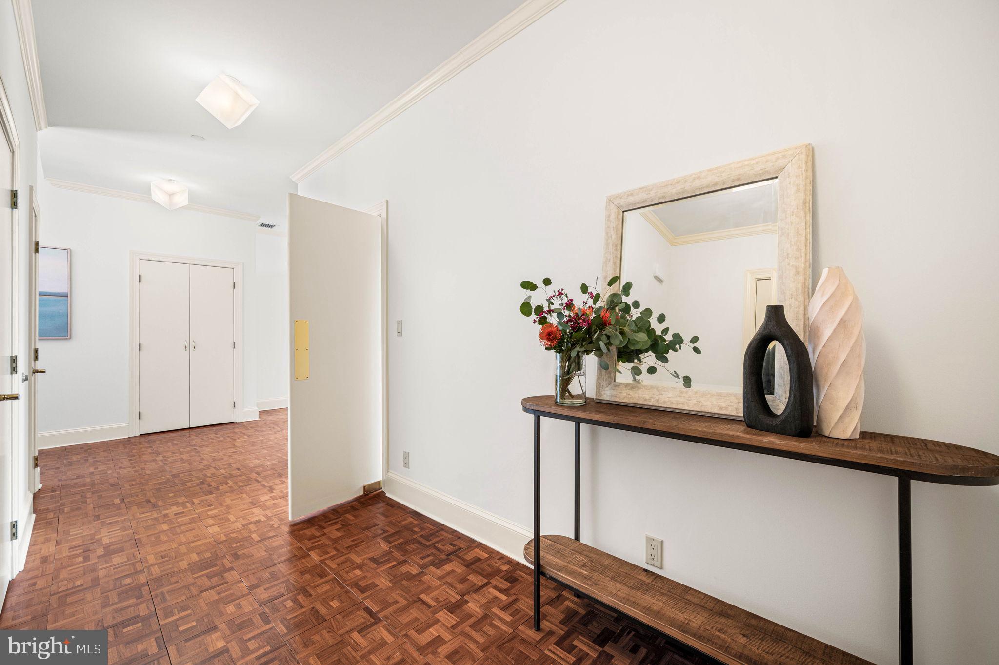 211 South 4th Street, Unit 301 Philadelphia, PA 19106 - Photo 21 of 42 a view of a hallway with a potted plant