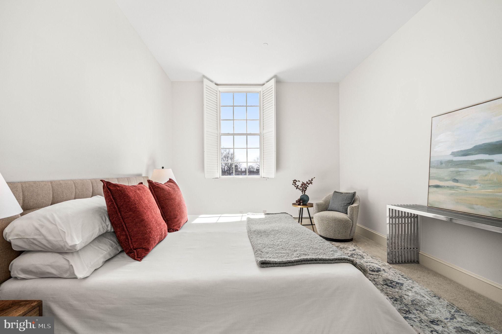 211 South 4th Street, Unit 301 Philadelphia, PA 19106 - Photo 23 of 42 a bedroom with a bed and window