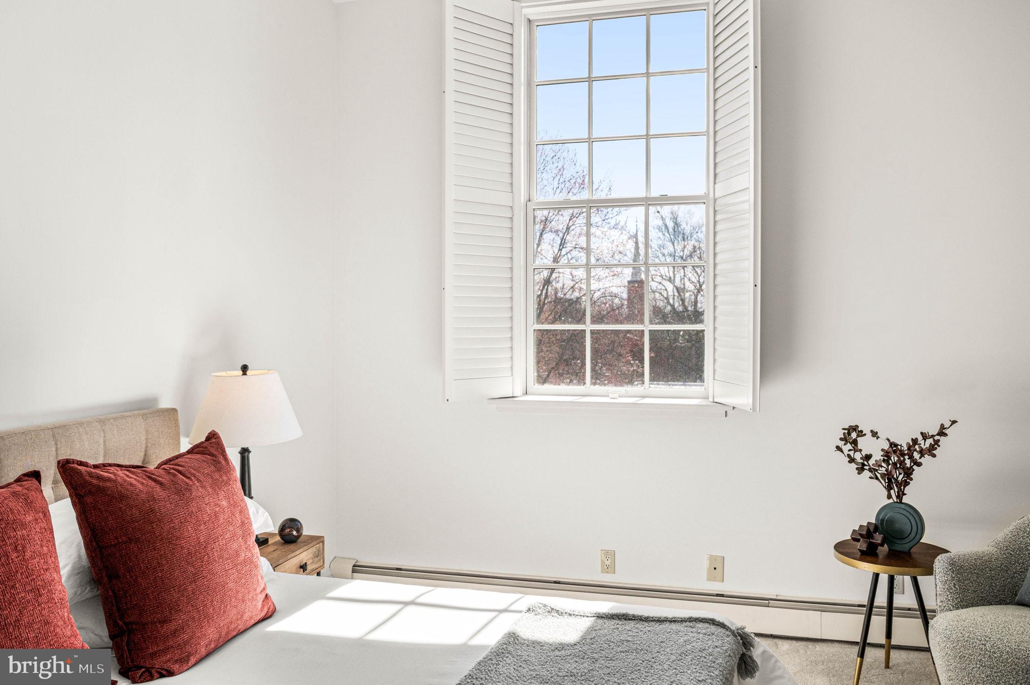 211 South 4th Street, Unit 301 Philadelphia, PA 19106 - Photo 24 of 42 a bedroom with a bed and a window
