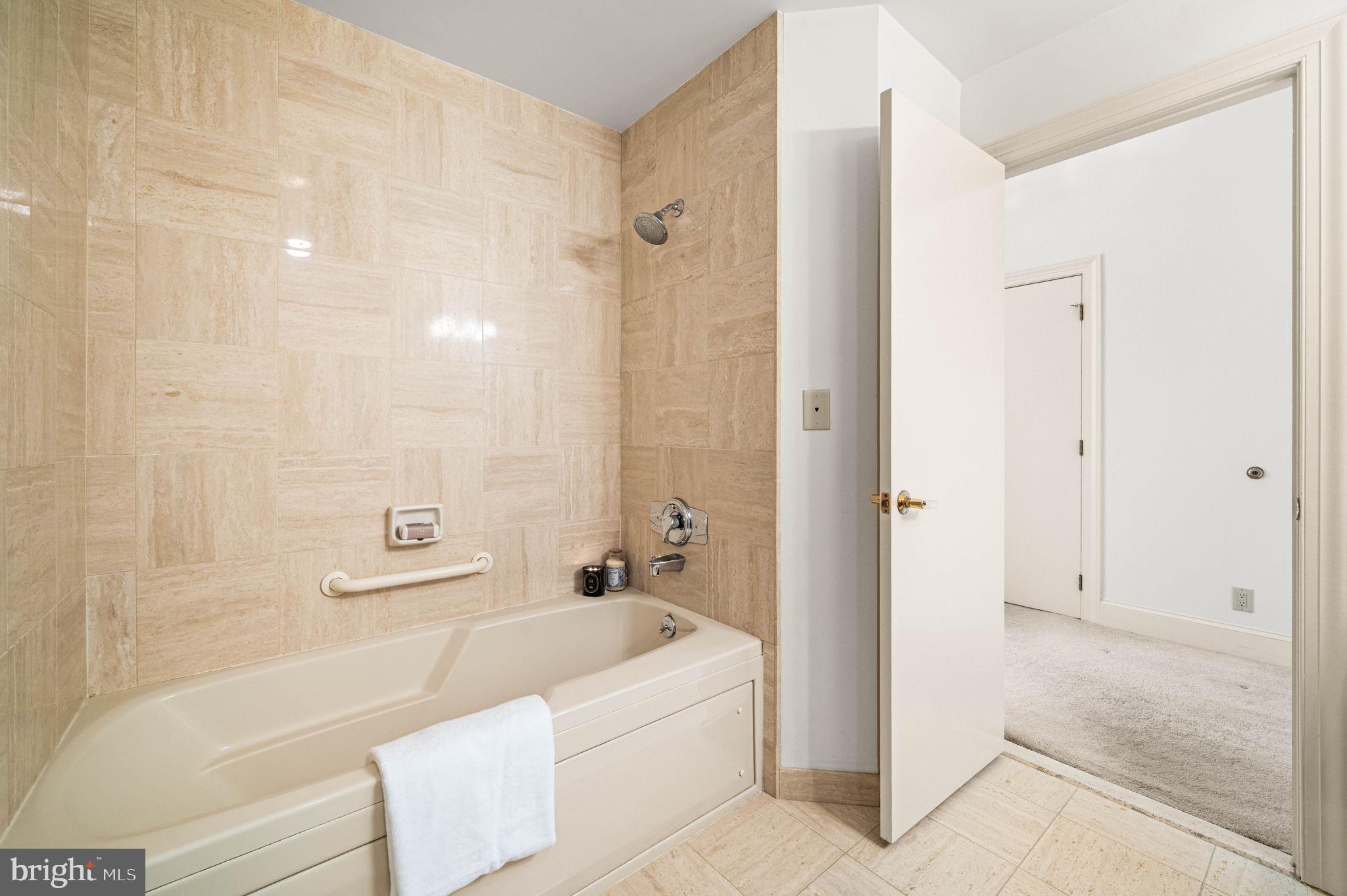 211 South 4th Street, Unit 301 Philadelphia, PA 19106 - Photo 28 of 42 a bathroom with a bathtub and a shower
